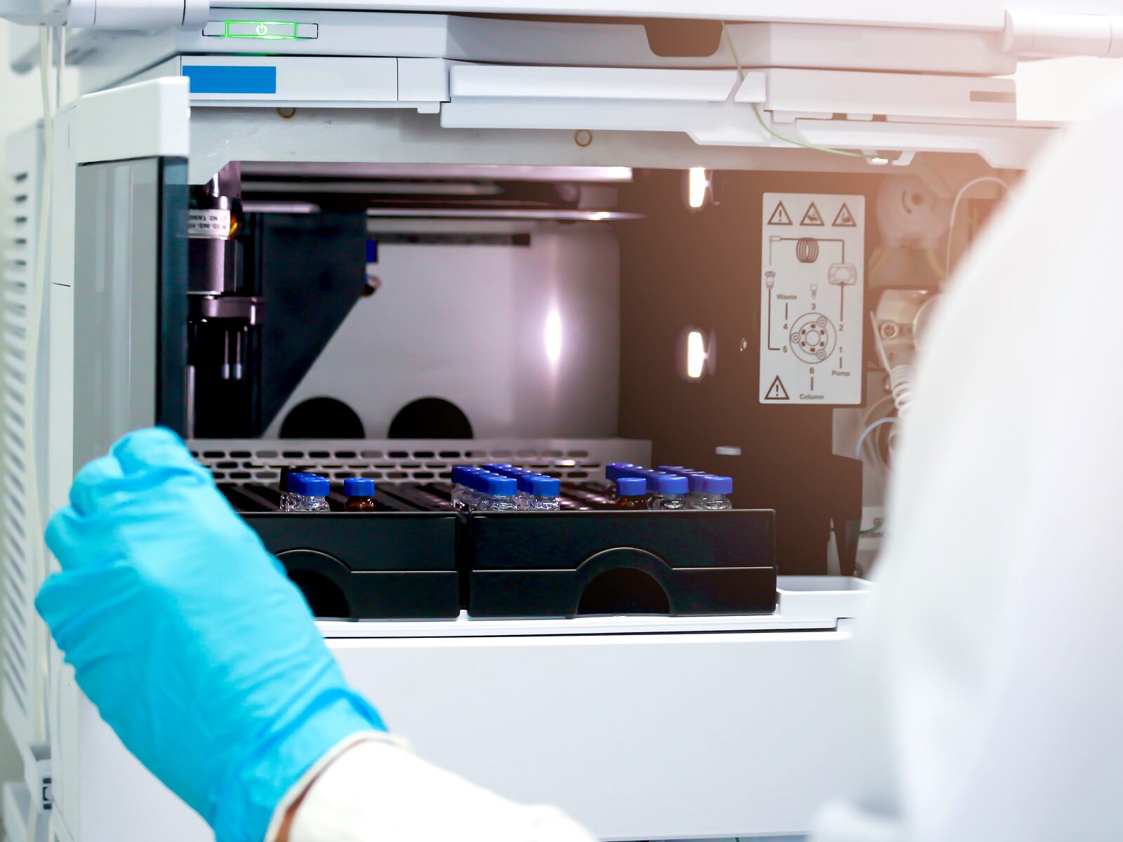 Scientist analyzing data with HPLC