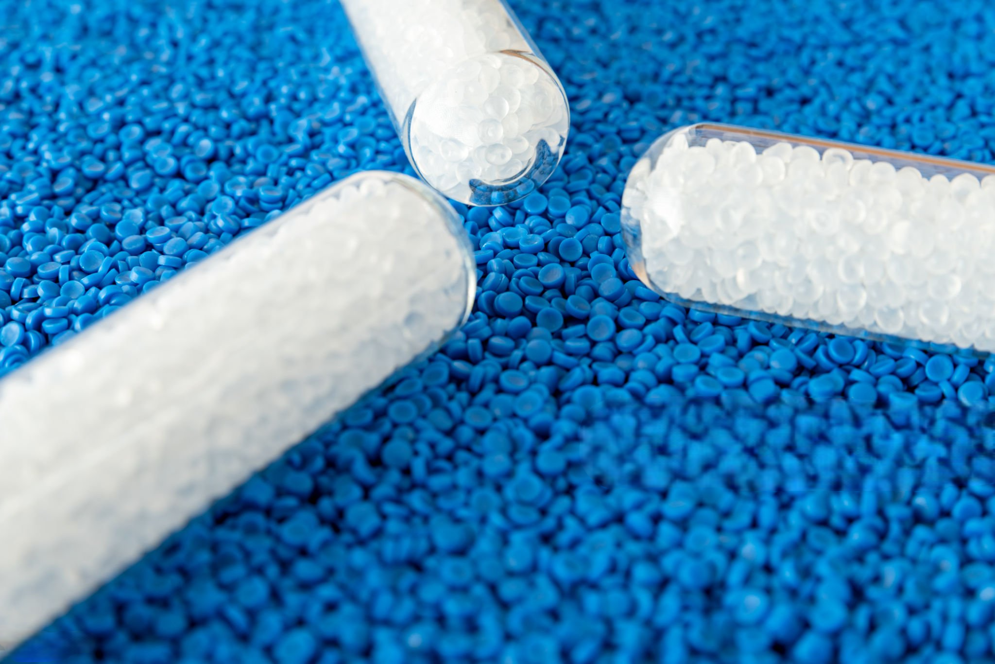 colored granules mixed with plastic resin